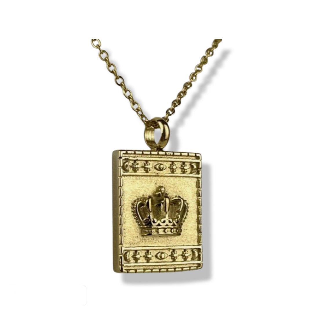 18K yellow gold plated stainless steel square pendant necklace with embossed royal crown detail surrounded by star and moon border. Necklace comes with an adjustable 20-22 inch chain.